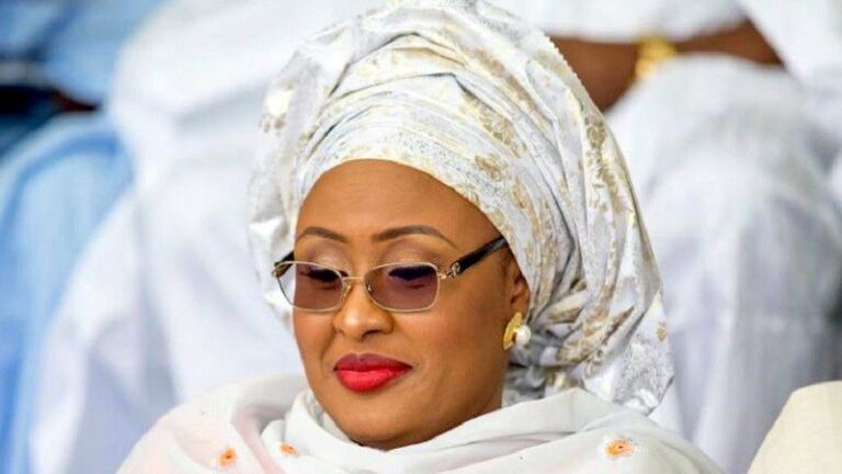 APC Primaries: Drama as Aisha Refuses to Climb Podium with Buhari to Hand Buhari flag